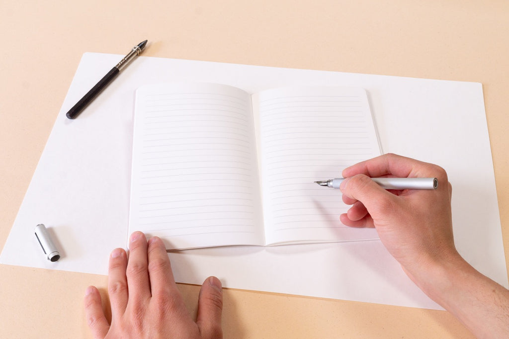 Cahier ligné - Les essentiels · Reliure Singer & dorure